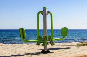 Exercise equipment near the water, a great place to try some outdoor gym workout ideas